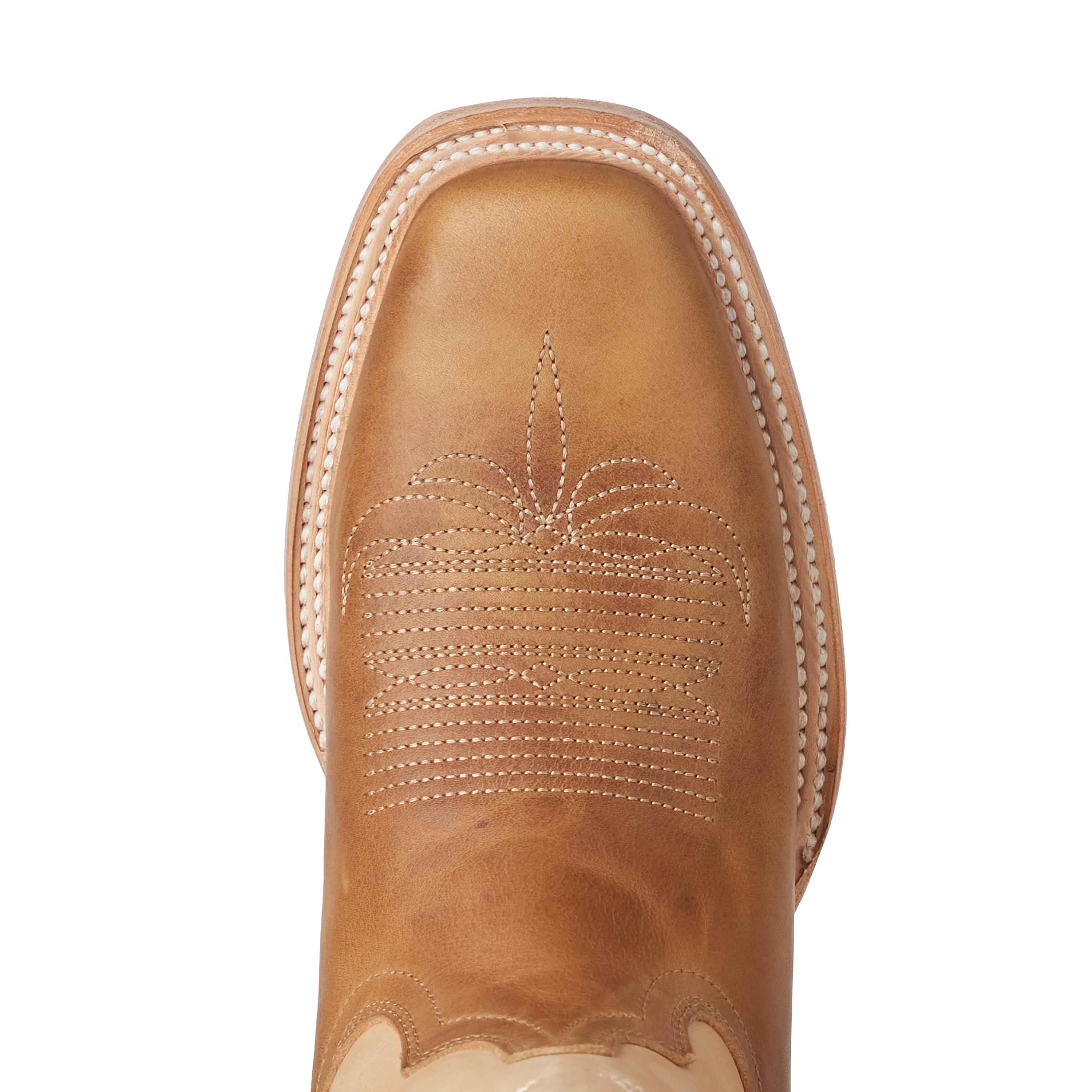 Close-up of a brown leather boot with white stitching on a white background