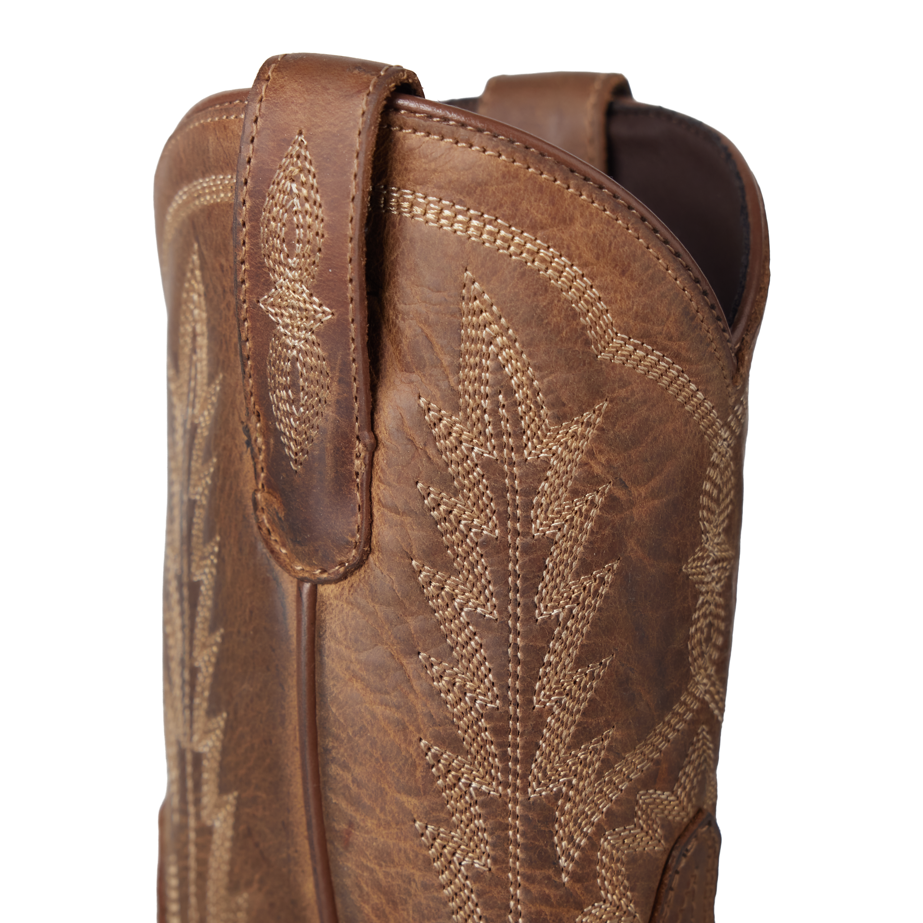 Close-up of a brown leather cowboy boot with intricate stitching on a white background
