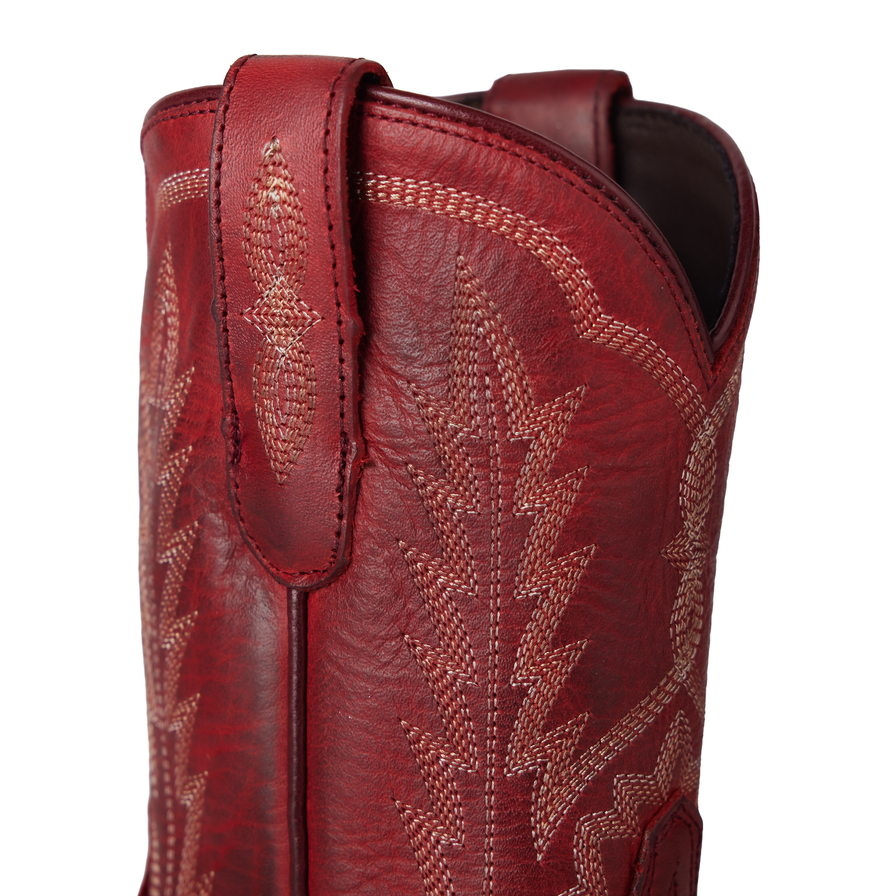Close-up of a red leather boot with intricate stitching on a white background