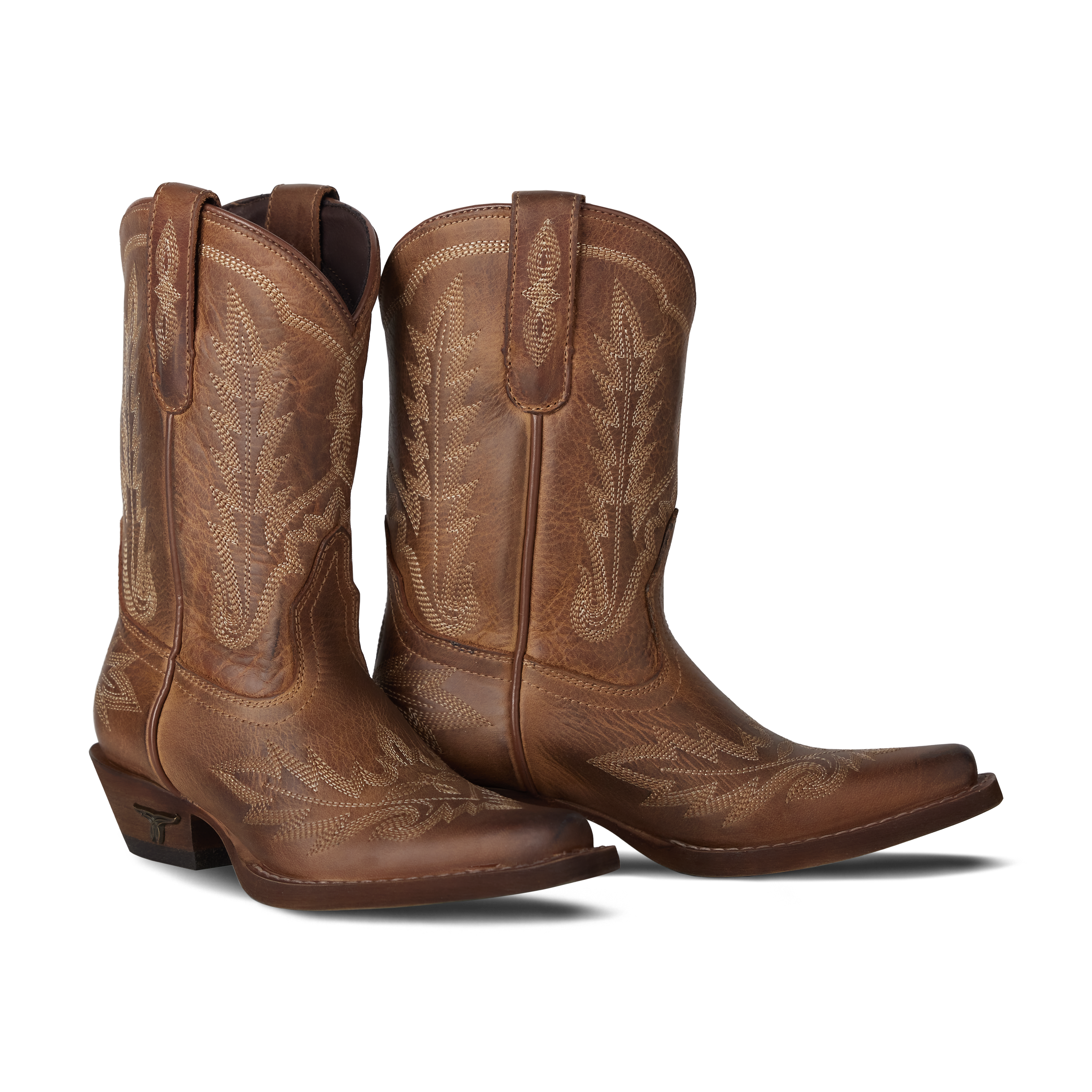 Pair of brown cowboy boots with intricate designs on a white background