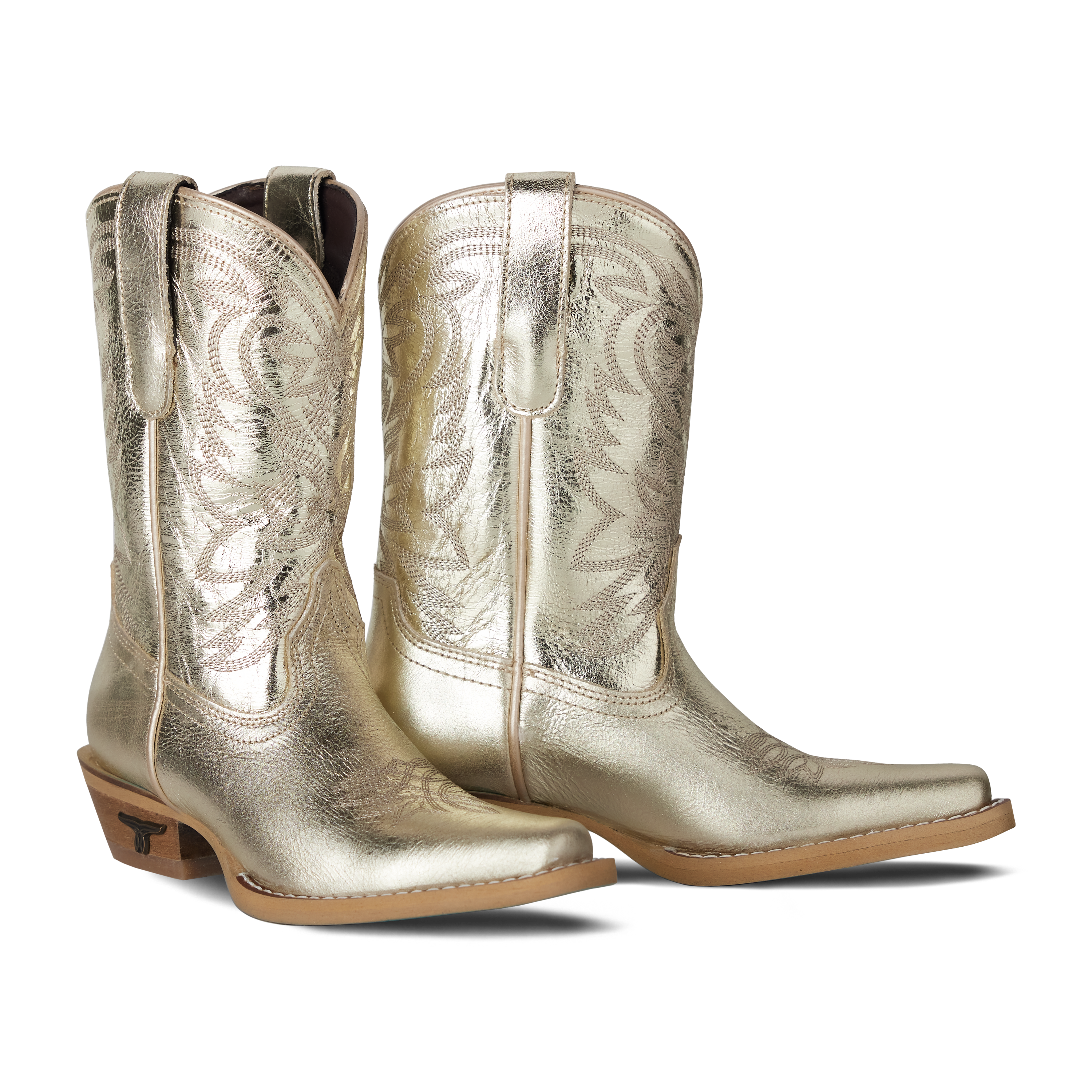 Pair of metallic gold cowboy boots on a white background